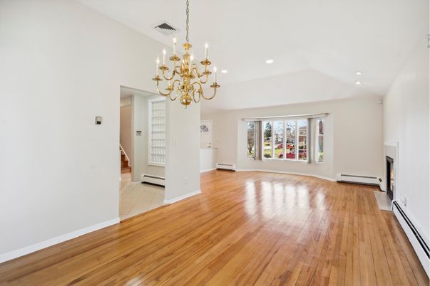 Chandelier, Empty room, Fireplace, Interior, Recessed Lighting, Wood Texture Flooring