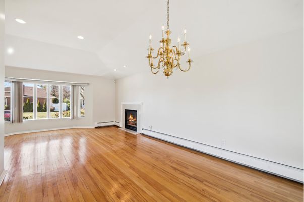 Chandelier, Empty room, Fireplace, Interior, Recessed Lighting, Wood Texture Flooring