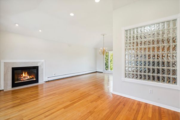 Chandelier, Empty room, Fireplace, Interior, Recessed Lighting, Wood Texture Flooring