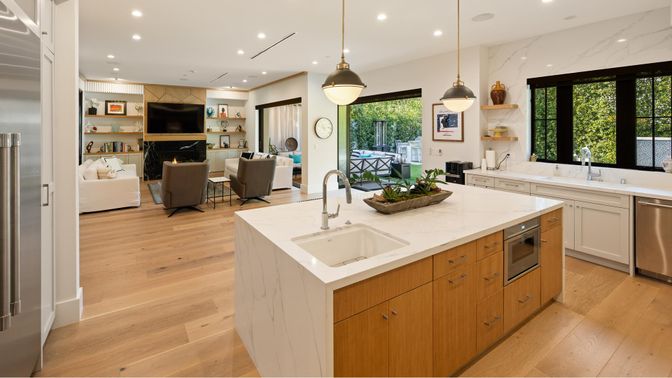 Fireplace, Interior, Kitchen, Living room, Marble Walls, Pendant Lights, Recessed Lighting, Stainless Steel Appliances, Wood Texture Flooring