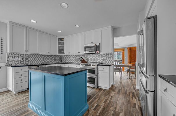 Dining room, Interior, Kitchen, Recessed Lighting, Stainless Steel Appliances, Wood Texture Flooring