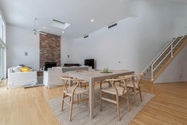Dining room, Fireplace, Interior, Living room, Recessed Lighting, Stone Walls, Wood Texture Flooring