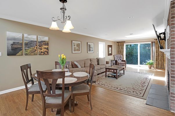 Dining room, Fireplace, Interior, Living room, Recessed Lighting, Stone Walls, Wood Texture Flooring