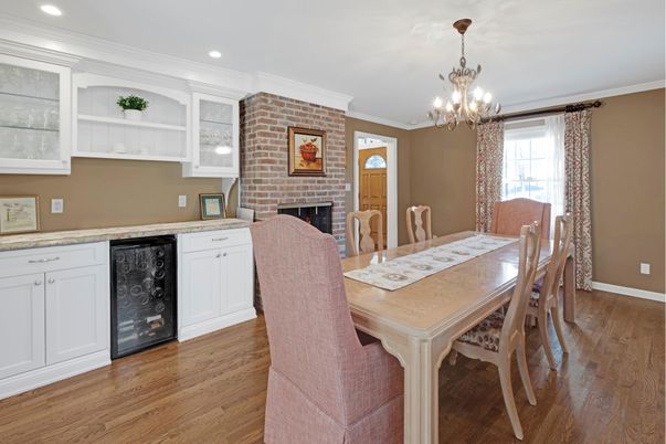 Chandelier, Dining room, Fireplace, Interior, Recessed Lighting, Stone Walls, Wood Texture Flooring