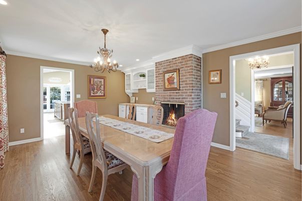 Chandelier, Dining room, Fireplace, Interior, Recessed Lighting, Stone Walls, Wood Texture Flooring