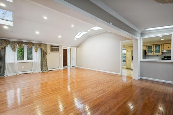 Empty room, Interior, Kitchen, Recessed Lighting, Stainless Steel Appliances, Wood Texture Flooring