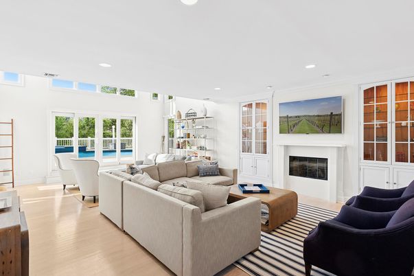 Fireplace, Interior, Living room, Recessed Lighting, Water, Wood Texture Flooring