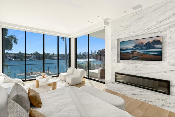 Bedroom, Fireplace, Interior, Living room, Marble Walls, Recessed Lighting, Water, Wood Texture Flooring