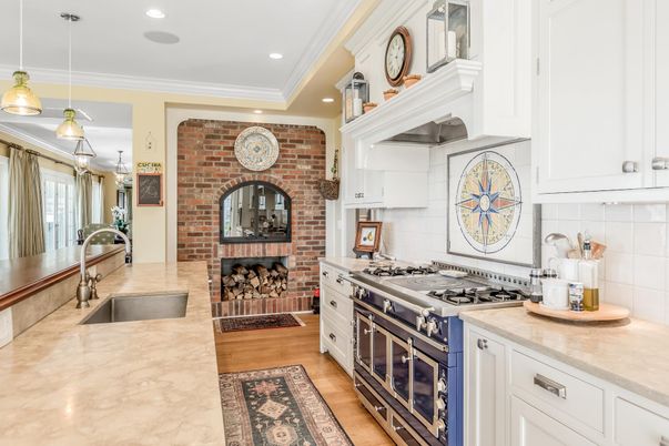 Fireplace, Interior, Kitchen, Pendant Lights, Recessed Lighting, Stainless Steel Appliances, Stone Walls, Wood Texture Flooring