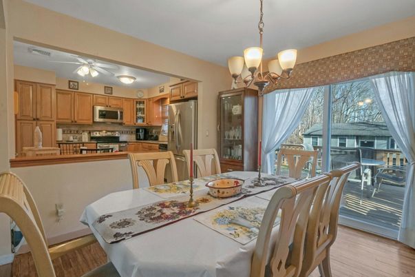 Chandelier, Dining room, Interior, Kitchen, Stainless Steel Appliances, Wood Texture Flooring