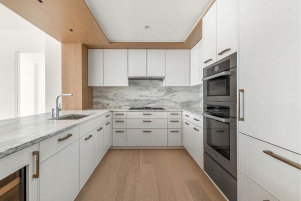 Interior, Kitchen, Marble Walls, Recessed Lighting, Stainless Steel Appliances, Wood Texture Flooring
