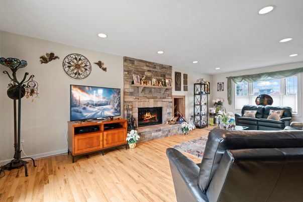 Fireplace, Interior, Living room, Recessed Lighting, Stone Walls, Wood Texture Flooring