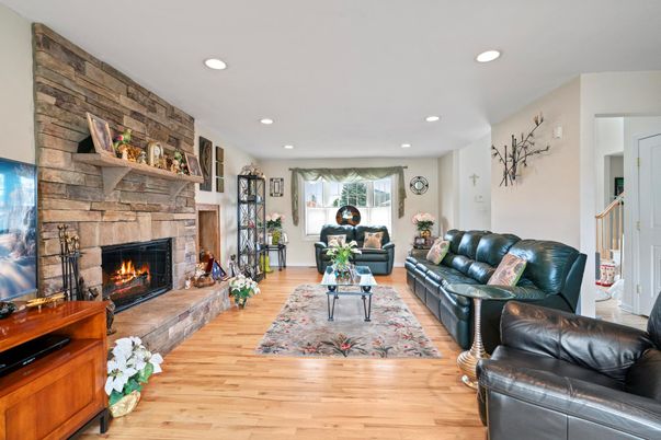 Fireplace, Interior, Living room, Recessed Lighting, Stone Walls, Wood Texture Flooring