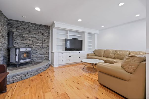 Fireplace, Interior, Living room, Recessed Lighting, Stone Walls, Wood Texture Flooring