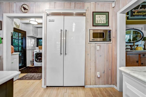 Interior, Kitchen, Stainless Steel Appliances, Washer, Wood Texture Flooring, Wooden Walls