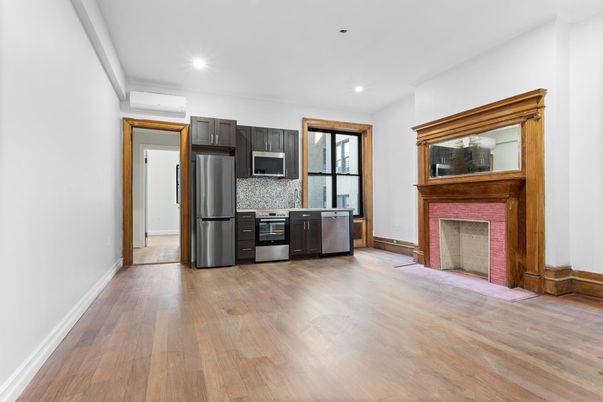 Fireplace, Interior, Kitchen, Recessed Lighting, Stainless Steel Appliances, Wood Texture Flooring