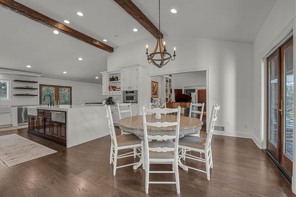 Chandelier, Dining room, Interior, Kitchen, Recessed Lighting, Stainless Steel Appliances, Wooden Beams, Wood Texture Flooring