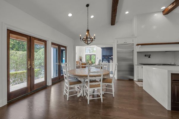 Chandelier, Dining room, Interior, Kitchen, Recessed Lighting, Stainless Steel Appliances, Wooden Beams, Wood Texture Flooring