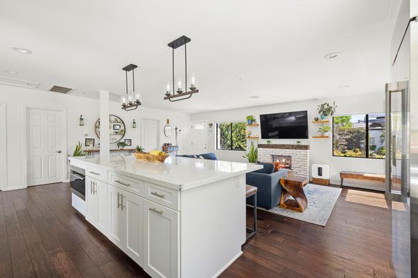 Fireplace, Interior, Kitchen, Living room, Pendant Lights, Recessed Lighting, Stainless Steel Appliances, Wood Texture Flooring