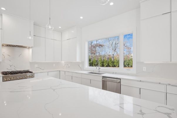 Interior, Kitchen, Marble Walls, Pendant Lights, Recessed Lighting, Stainless Steel Appliances