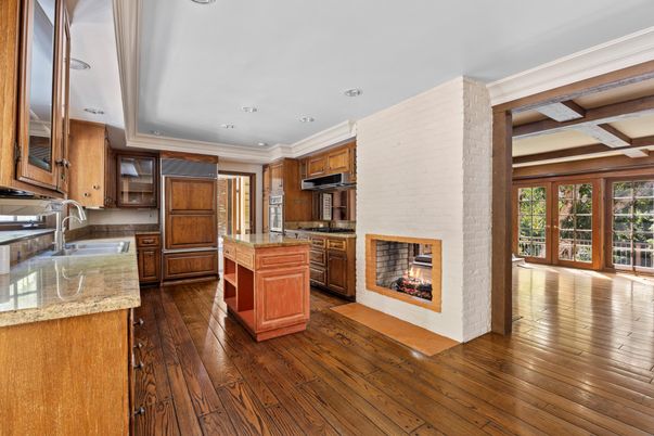 Fireplace, Interior, Kitchen, Recessed Lighting, Stainless Steel Appliances, Stone Walls, Wood Texture Flooring