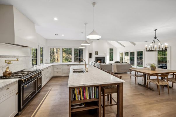 Chandelier, Dining room, Fireplace, Interior, Kitchen, Living room, Pendant Lights, Recessed Lighting, Stainless Steel Appliances, Wood Texture Flooring