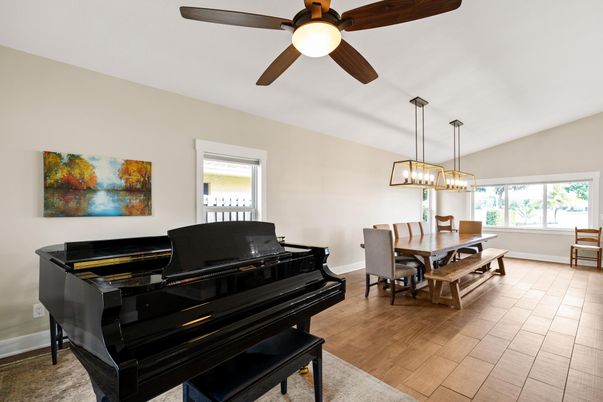 Dining room, Interior, Pendant Lights, Piano, Wood Texture Flooring