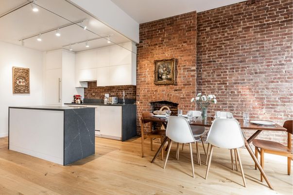 Dining room, Fireplace, Interior, Kitchen, Recessed Lighting, Stone Walls, Wood Texture Flooring