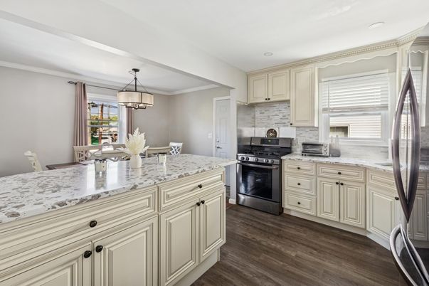 Dining room, Interior, Kitchen, Pendant Lights, Recessed Lighting, Stainless Steel Appliances, Wood Texture Flooring