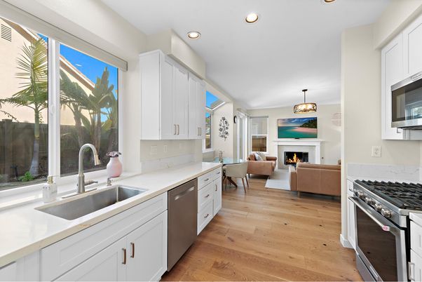 Fireplace, Interior, Kitchen, Living room, Pendant Lights, Recessed Lighting, Stainless Steel Appliances, Wood Texture Flooring