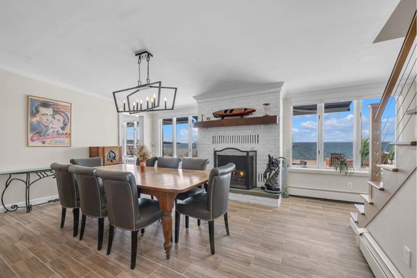 Dining room, Fireplace, Interior, Pendant Lights, Water, Wood Texture Flooring