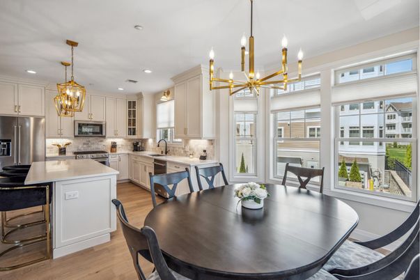 Chandelier, Dining room, Interior, Kitchen, Pendant Lights, Recessed Lighting, Stainless Steel Appliances, Wood Texture Flooring
