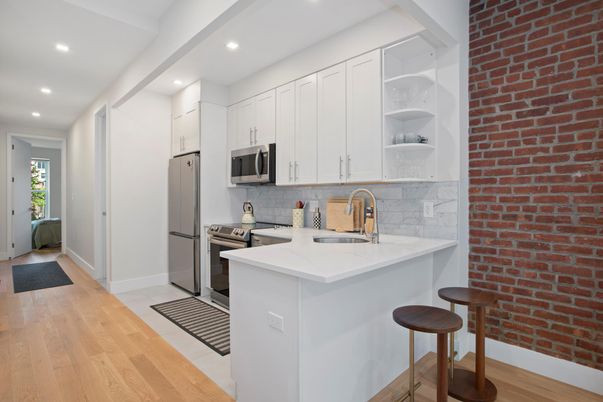 Interior, Kitchen, Recessed Lighting, Stainless Steel Appliances, Stone Walls, Wood Texture Flooring