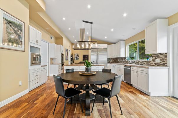 Dining room, Interior, Kitchen, Pendant Lights, Recessed Lighting, Stainless Steel Appliances, Wood Texture Flooring