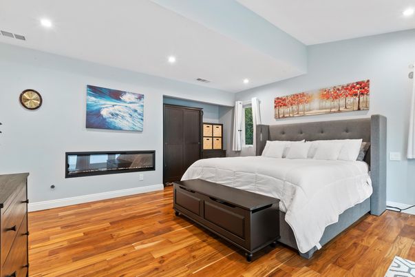 Bedroom, Fireplace, Interior, Recessed Lighting, Wood Texture Flooring