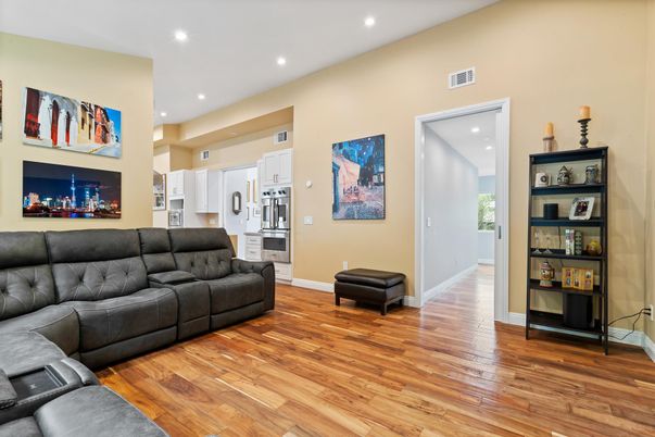 Fireplace, Interior, Kitchen, Living room, Recessed Lighting, Stainless Steel Appliances, Wood Texture Flooring