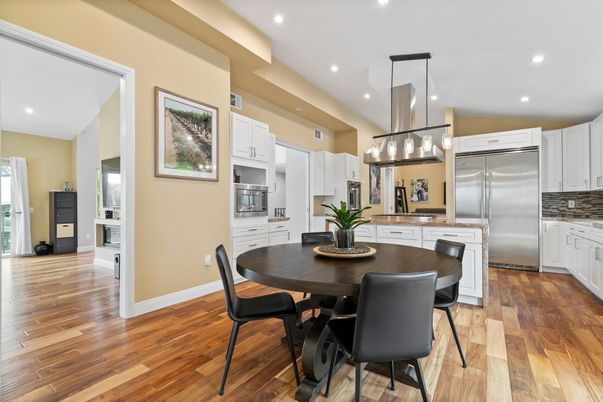 Dining room, Interior, Kitchen, Pendant Lights, Recessed Lighting, Stainless Steel Appliances, Wood Texture Flooring