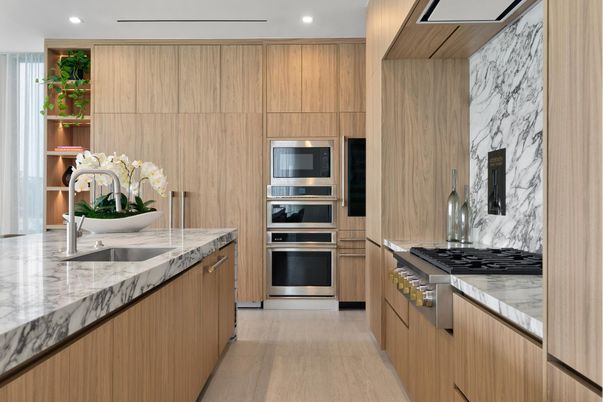 Interior, Kitchen, Marble Walls, Recessed Lighting, Stainless Steel Appliances, Wood Texture Flooring