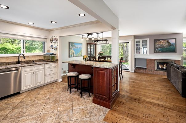 Dining room, Fireplace, Interior, Kitchen, Pendant Lights, Recessed Lighting, Stainless Steel Appliances, Wood Texture Flooring