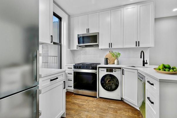Interior, Kitchen, Recessed Lighting, Washer, Wood Texture Flooring