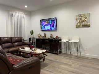 Fireplace, Interior, Living room, Recessed Lighting, Wood Texture Flooring
