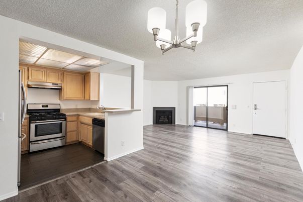 Chandelier, Fireplace, Interior, Kitchen, Stainless Steel Appliances, Wood Texture Flooring
