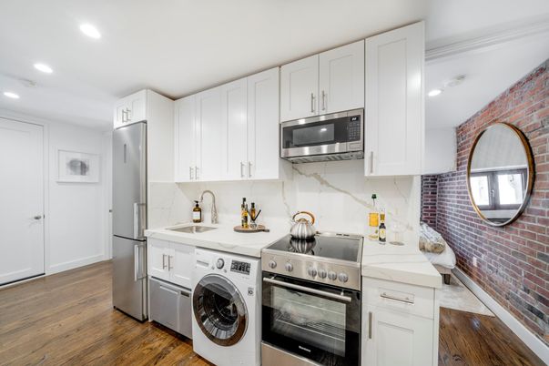 Interior, Kitchen, Recessed Lighting, Stainless Steel Appliances, Stone Walls, Utility Closets, Washer, Wood Texture Flooring
