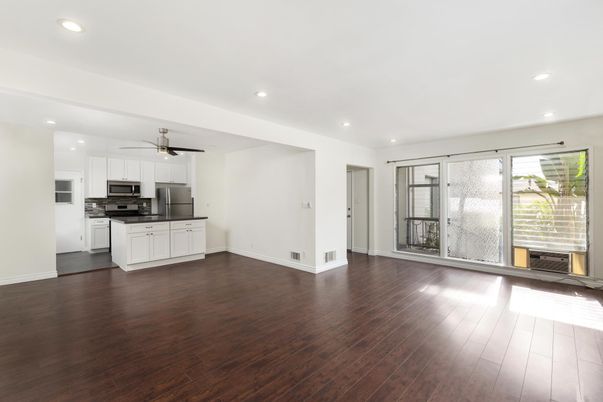 Empty room, Interior, Kitchen, Recessed Lighting, Stainless Steel Appliances, Wood Texture Flooring