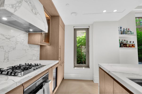 Interior, Kitchen, Marble Walls, Recessed Lighting, Stainless Steel Appliances, Wood Texture Flooring
