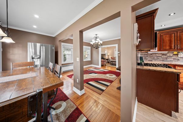 Chandelier, Dining room, Interior, Kitchen, Pendant Lights, Recessed Lighting, Stainless Steel Appliances, Wood Texture Flooring
