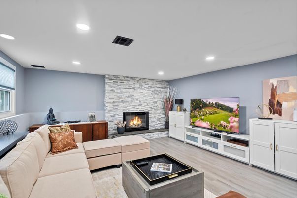 Fireplace, Interior, Living room, Recessed Lighting, Stone Walls, Wood Texture Flooring