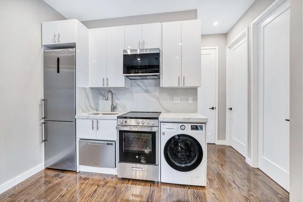 Interior, Kitchen, Recessed Lighting, Washer, Wood Texture Flooring