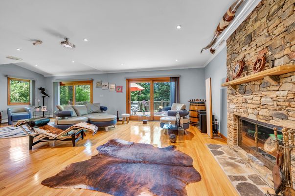 Fireplace, Interior, Living room, Recessed Lighting, Stone Walls, Wood Texture Flooring