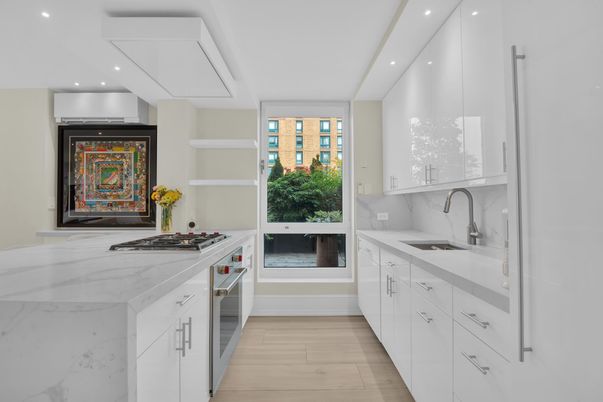 Interior, Kitchen, Marble Walls, Recessed Lighting, Stainless Steel Appliances, Wood Texture Flooring
